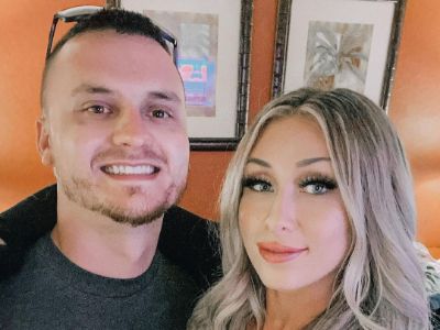 Nikkole Ledda is taking a selfie as Kyle Ledda is smiling for the picture.